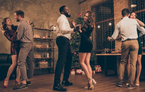 couple dancing at new years eve party | Coastline Realty