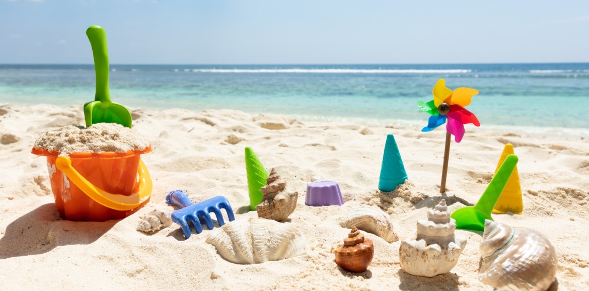 beach toys on the beach | Coastline Realty